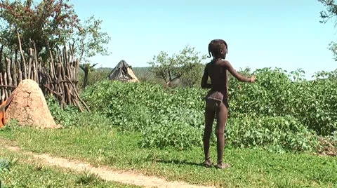 African native tribes - Young Himba boy watching the herd in Namibia Vídeos de archivo 26929354