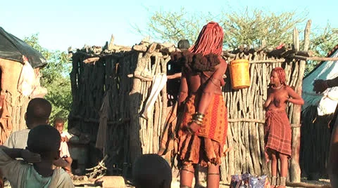 African native tribes - Young Himba women in front of their hut in Namibia 動画素材 27029080