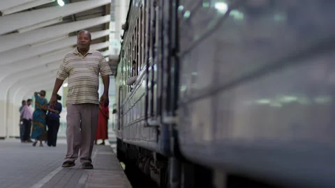 African old man Walk Along Side Of A Train In A Station.DaresSalaam Tanzania Stock Footage 132507853