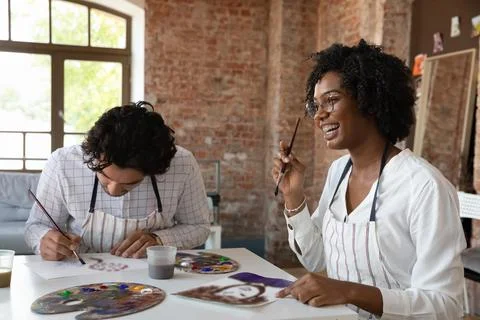 African painter woman with groupmate painting, attend in art class Stock Photos
