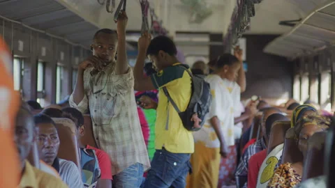 African passengers on a moving old train, Tanzania Africa Stock Footage 132470665