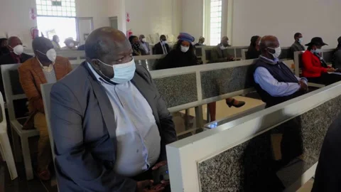 African people social distancing in a small church, at a funeral service Video stock 137336653