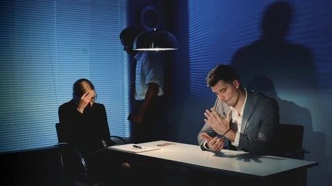 African policeman using force in questioning the accused caucasian man. Stock Footage 122922204