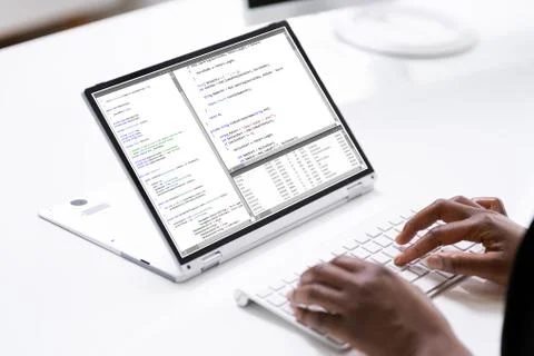 African Programmer Or Coder Using Hybrid Laptop Stock Photos