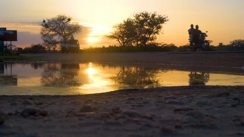 African road reflection at sunset Stock Footage 102411575