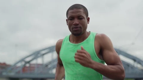 African runner jogging on bridge Video stock 117064467