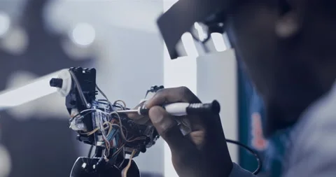 African scientist working on human exoskeleton model. Futuristic laboratory Stock Footage 150445020