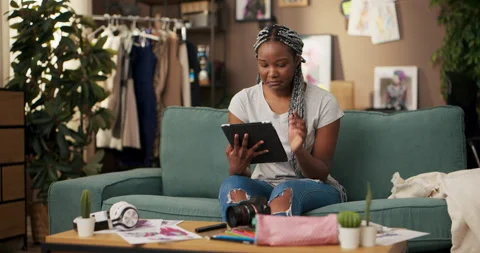African software developer, specializing in mobile app development uses tablet Stock Footage 244696071
