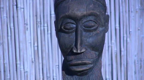 African statue on a beach Stock Footage 1092107