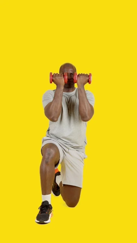 African strong man doing dumbbell Arnold press Stock Footage 241738892