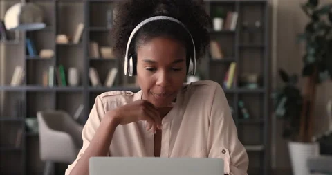 African student communicates with mate by videocall app on laptop Stock Footage 146254377