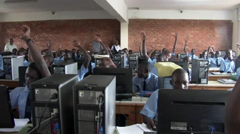 African students all raise hand to answer a question at school -Education Africa Stock Footage