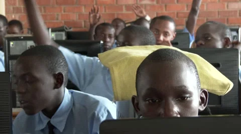 African students studying at computer lab in school raising hand-Edu in Africa Stock Footage 58991971
