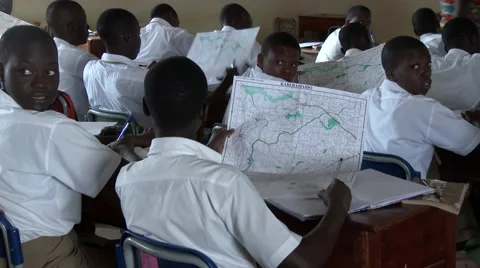 African students studying geography at school using maps - Education in Africa Stock Footage 58990083
