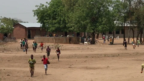 African students walking through school compound in Malawi, Africa Video stock 111592224