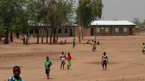 African students walking through school compound in Malawi, Africa Video stock 111592287