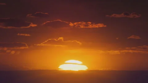 African sunset time lapse with big sun and backlit clouds. Cinematic 4k footage. Vídeos de archivo 155449604