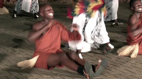 African tribe warrior dancing like boat sailing skulling,tribesmen jump clap Stock Footage 59799571