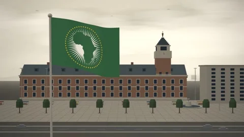 African Union Flag Flying Over City Hall Clock Tower seamless loop Video stock 344782909