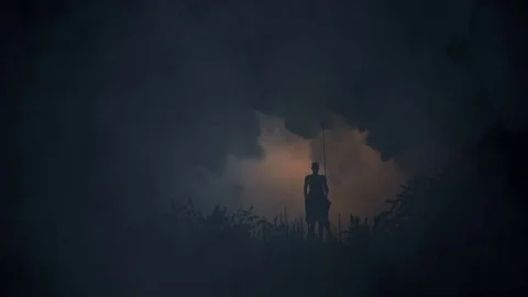 African Warrior with Spear standing in a Middle of a Storm Stock Footage 84630050