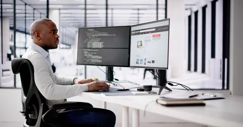 African Web Developer Programming Online Shop In Office Stock Photos