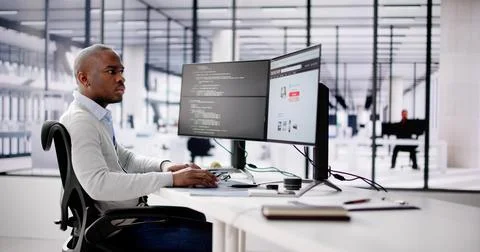 African Web Developer Programming Online Shop In Office Stock Photos