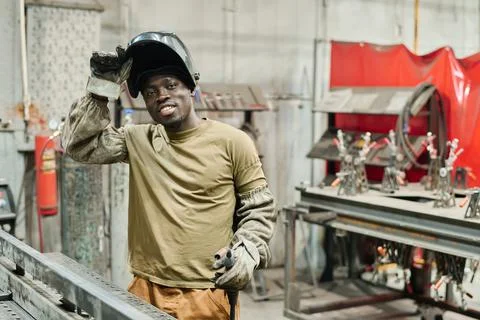 African welder working with metal products Stock Photos