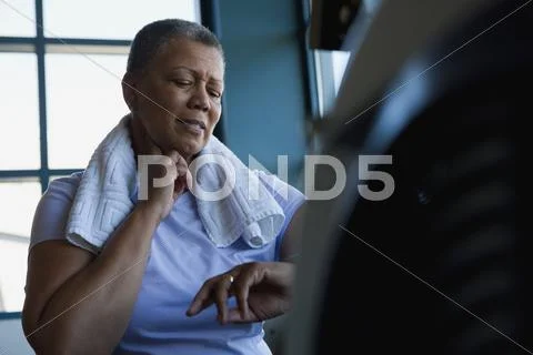 African Woman Checking Pulse In Health Club