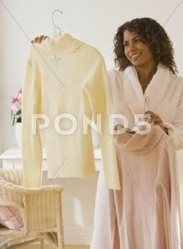 African woman deciding what to wear Stock Photos