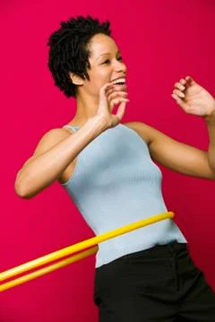 African woman playing with hula hoop Stock Photos