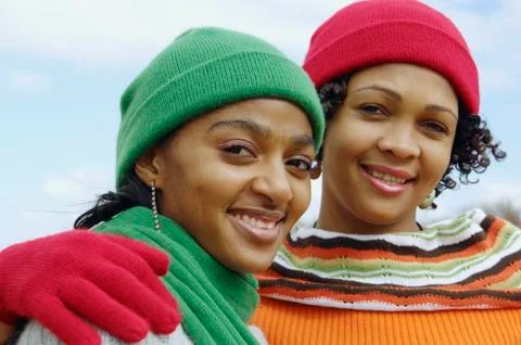 African women wearing winter hats and scarves Stock Photos