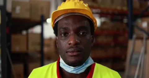 African worker man inside delivery boxes warehouse Stock Footage 145434566