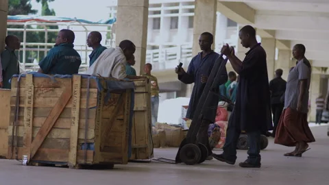 African worker moving goods at the train station,DaresSalaam Tanzania Stock Footage 132122607