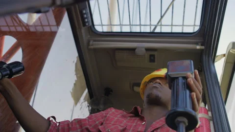 African worker operating crane at construction site,Tanzania  Africa Stock Footage 132044656