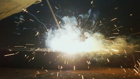 African worker welding at construction site in the evening,Tanzania  Africa Stock Footage 132187801