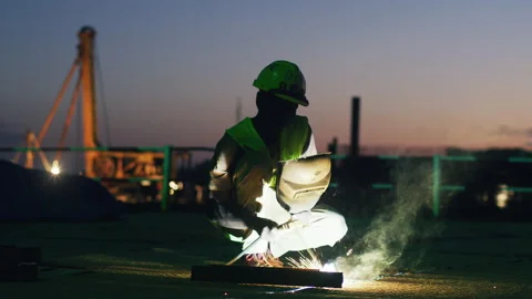African worker welding at construction site in the evening,Tanzania  Africa Video stock 132210939