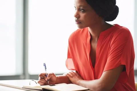 African writer looking up into distance while taking a break Stock Photos