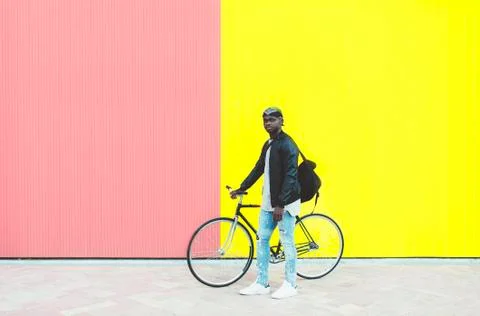 African young man with fixed gear bicycle.