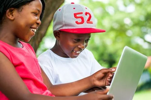 African youngsters enjoying time with laptop. Stock Photos