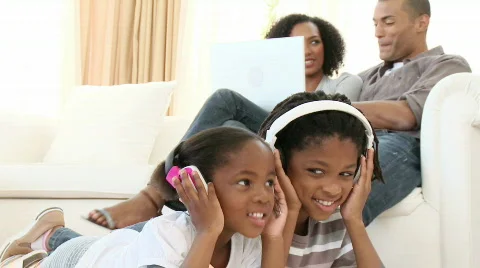 Afro-American children listening to the music at home Stock Footage
