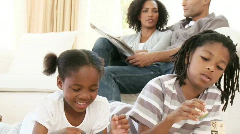 Afro-American children playing with cube toys at home Stock Footage