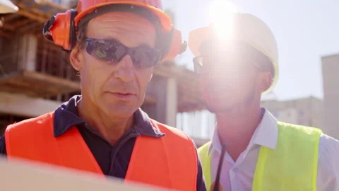 Afro American engineer and other group of diverse specialists at building Stock Footage 144286450