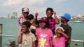 Afro-American family sings a song on the shore of the Gulf of Siam in Pattaya HD Footage