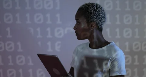 Afro American female programmer in front of coding projection Stock Footage 104195201