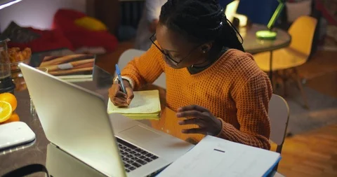 Afro american female student doing homework Stock Footage