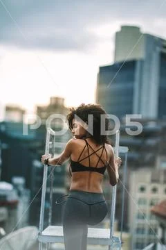 Afro american fitness woman doing workout on rooftop Stock Photos