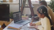 Afro-American Girl Studying Online At Home With Help Of Father Stock Footage