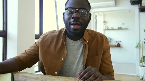 Afro-American guy in chat man in glasses talks at videocall Stock Footage 158982391