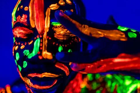 Afro american man posing in studio shot with UV light Stock Photos