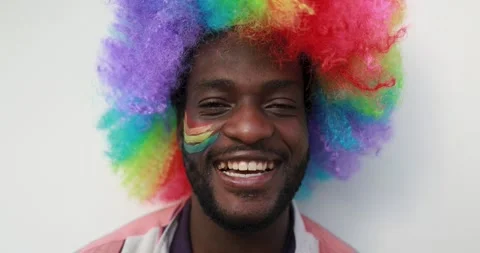 Afro american man smiling in front of the camera at gay pride outdoor Stock Footage 145430219